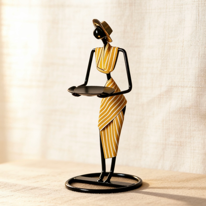 Metal art candle holder in cozy living room with dried flowers and frames