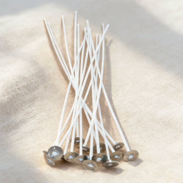 Cotton candle wicks with metal bases, essential for candle making, providing a stable setup and clean burn for DIY candle projects