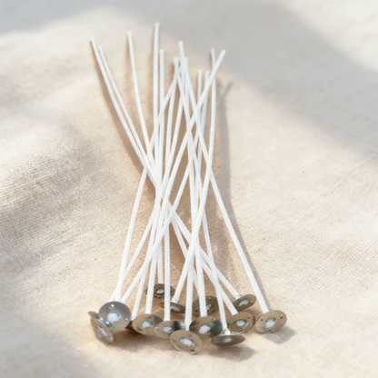 Cotton candle wicks with metal bases, essential for candle making, providing a stable setup and clean burn for DIY candle projects