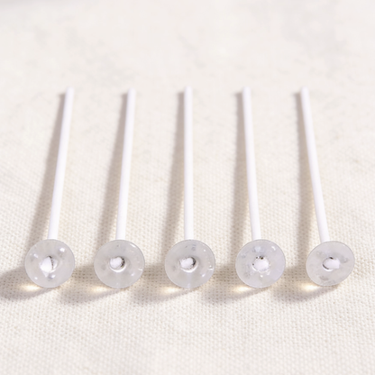 Cotton candle wicks with plastic bases, essential for candle making, providing a stable setup and clean burn for DIY candle projects