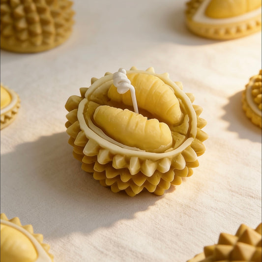 Collection of durian-shaped candles with open and closed shell designs