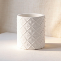 White ceramic candle jar with 3D diamond geometric pattern