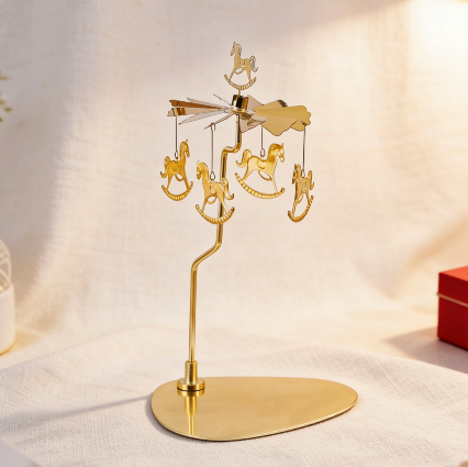 Gold spinning candle carousel with horse ornaments