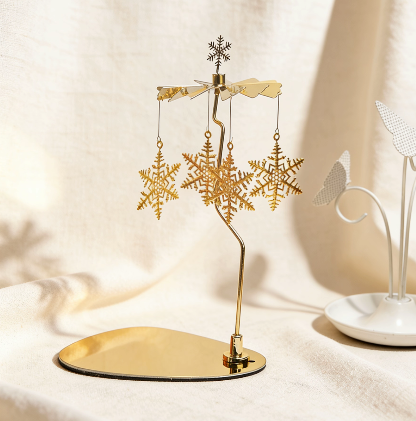 Gold rotary candle carousel with snowflake charms