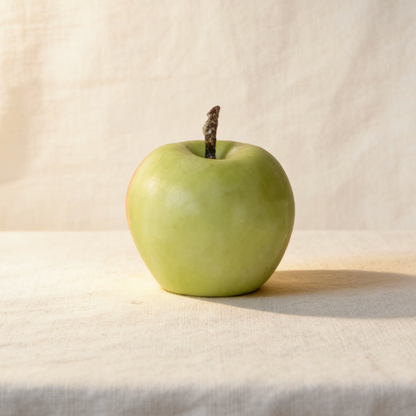 Realistic green apple shaped handmade decorative candle