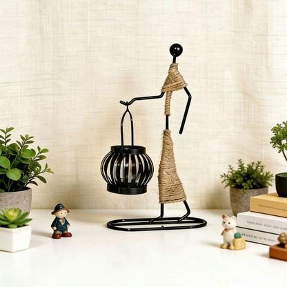 Lantern design candle holder with mini figurines and greenery