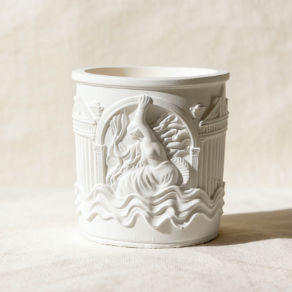 White ceramic candle jar with mermaid relief carving