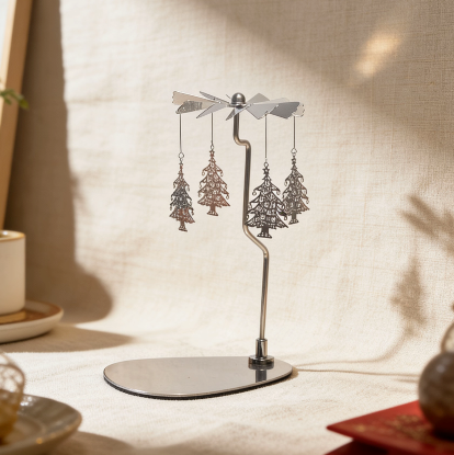 Silver spinning candle carousel with Christmas tree charms
